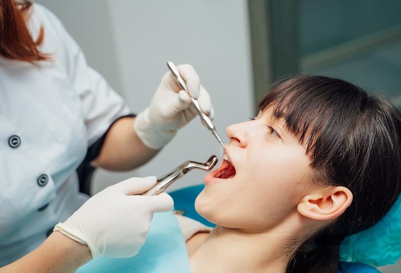 woman-having-teeth-examined-dentists.jpg